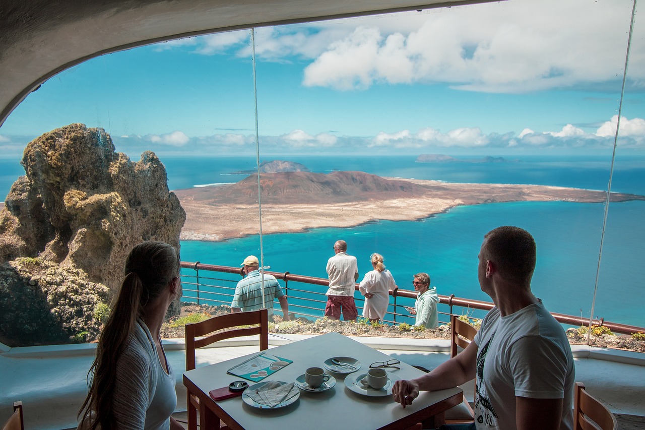 A view of the coastline from inside of a restaurant.
